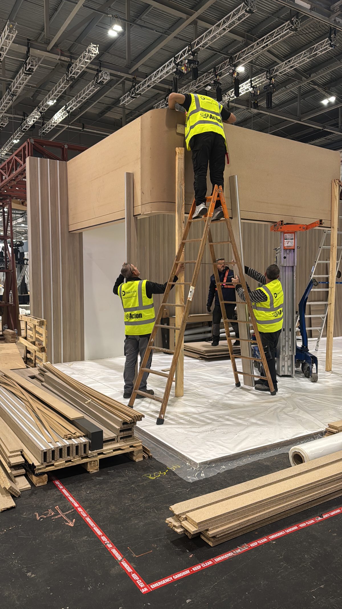 Dum Event build crew working on a stand structure during build-up