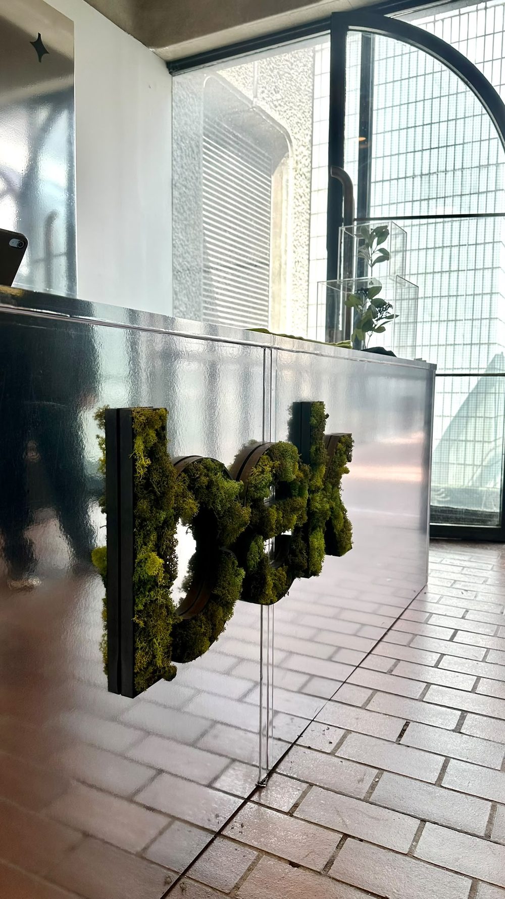 Custom moss logo counter built for a corporate event